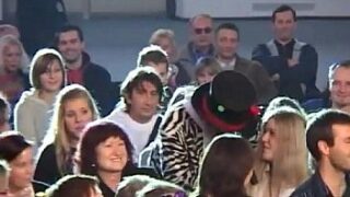 Hot black-haired female entices the crowd