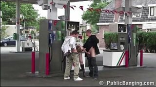 Very pregnant woman is fucked in public sex threesome orgy at a gas station