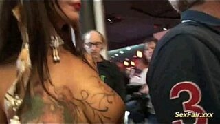 Doll fucks with dildo on sexfair stage